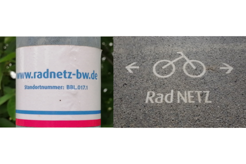 RadNETZ-Sticker auf einer S&auml;ule und auf dem Asphalt aufgebrachtes Fahrradsymbol und Schriftzug "RadNETZ"